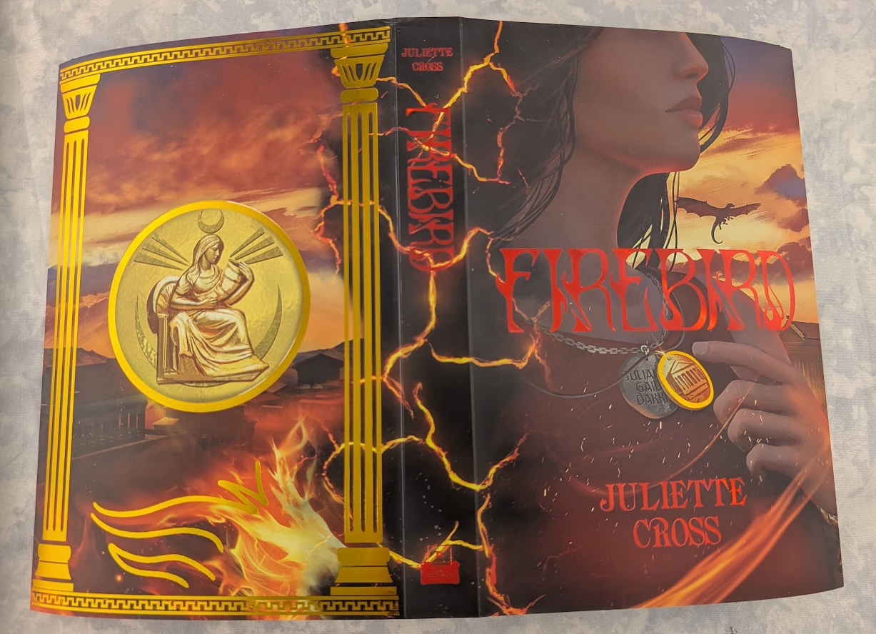 A book titled 'Firebird' by Juliette Cross, showing both the front and back covers. The covers feature a dark, fiery illustration with gold classical columns, lightning, and a central gold emblem.