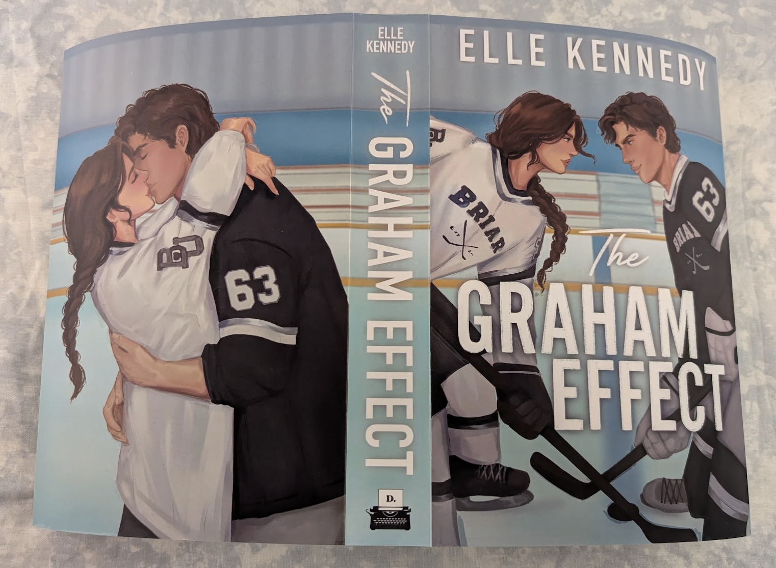 The front and spine of the book 'The Graham Effect' by Elle Kennedy, featuring an illustration of hockey players on the cover against a light gray textured background.