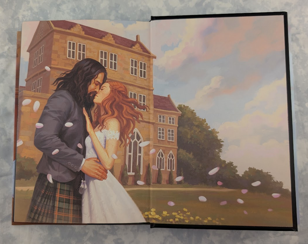 The endpapers of a hardcover book showing a romantic couple embracing in front of a large estate, photographed flat against a mottled light gray surface. The artwork depicts a man in a dark suit and plaid kilt, a woman in a white dress, falling petals, and a pastel sky.